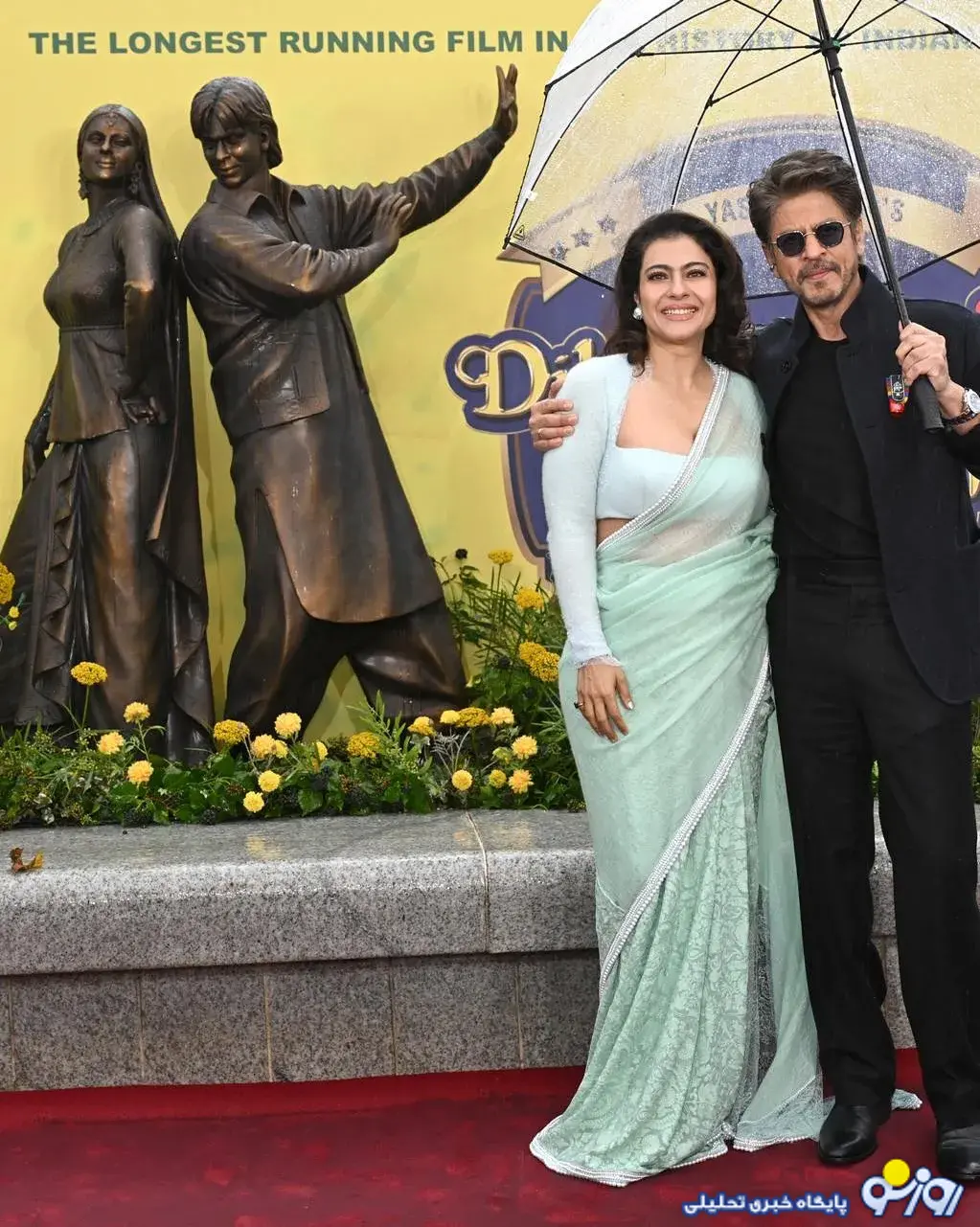 شاهرخ خان و کاجول، از مجسمههای خودشان در لندن رونمایی کردند شاهرخ خان و کاجول، از مجسمههای خودشان در لندن رونمایی کردند