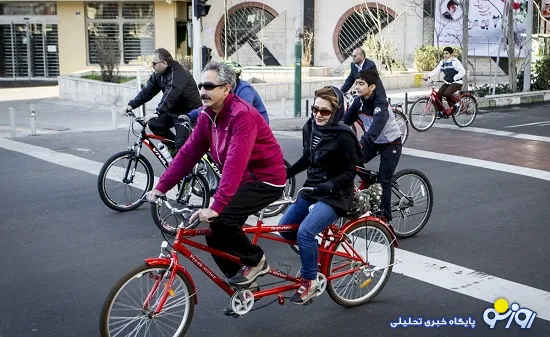 عکسی جالب از یک زن و مرد دوچرخه سوار در تهران